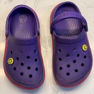 Purple Crocs with red soles, size 10/11